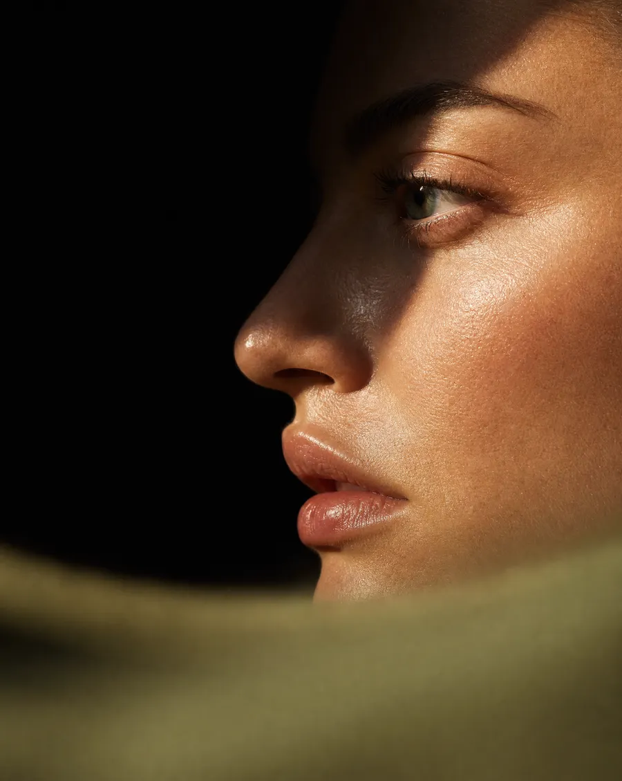 A face in warm, soft light