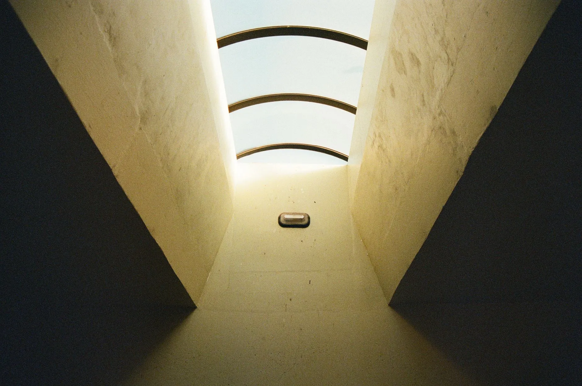Daylight falling through a skylight in a quiet modern building
