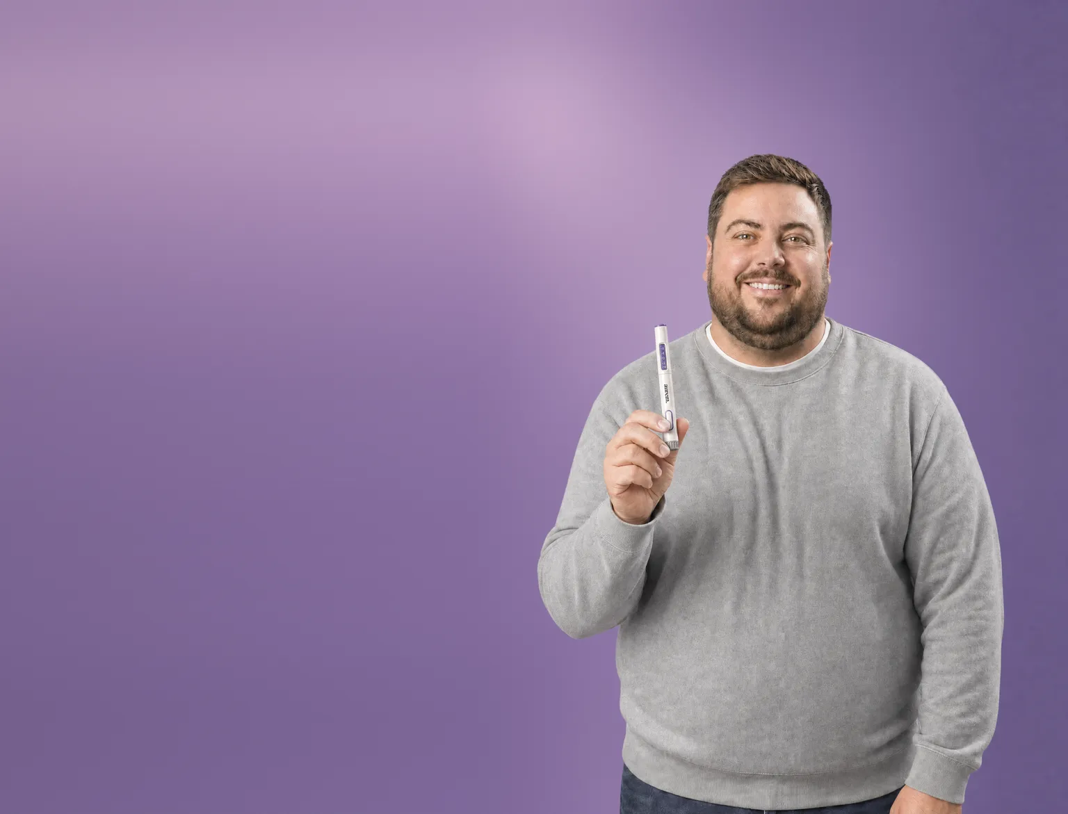 A man smiling in soft daylight
